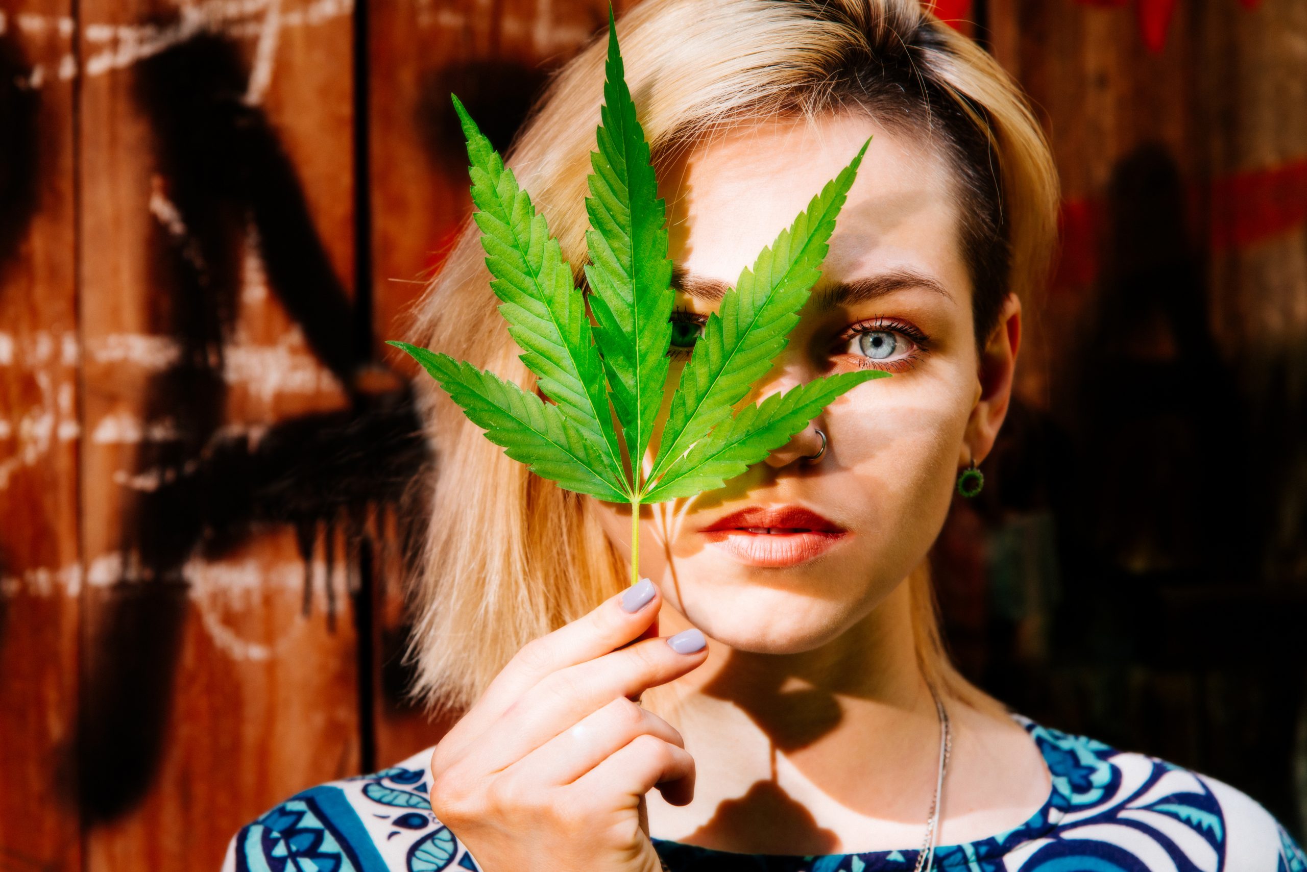GIRL AND CANNABIS PLANT 164221597 1 scaled 1 | Smoking